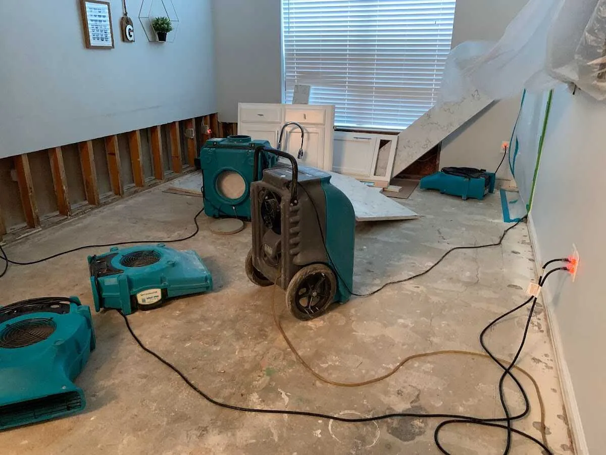 Dehumidifier in flood-cut room for Water Damage Restoration in Tanaina